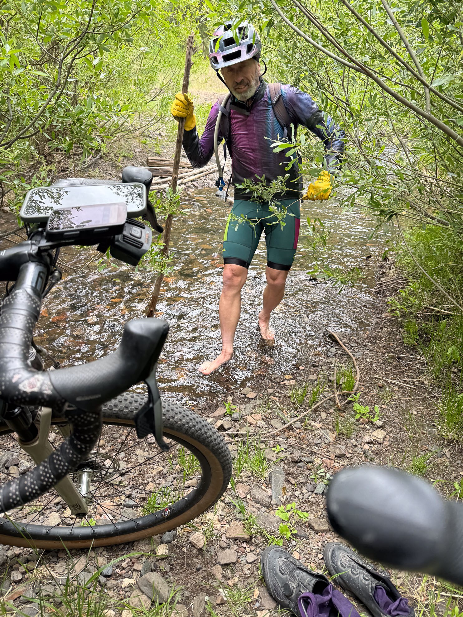 Author wading across a cold creek